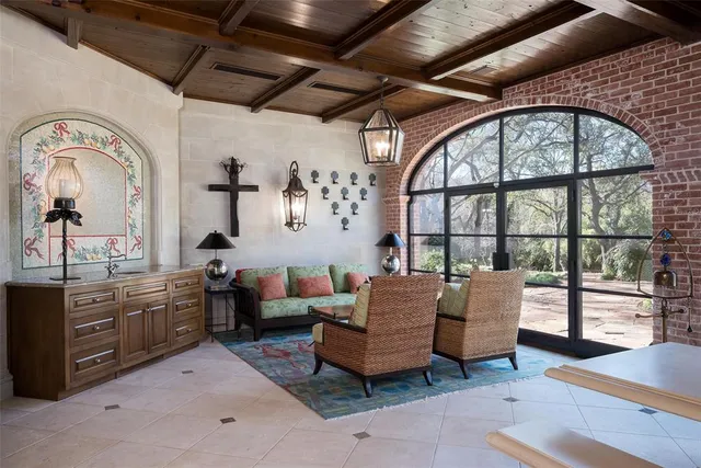 a bedroom with furniture and a window