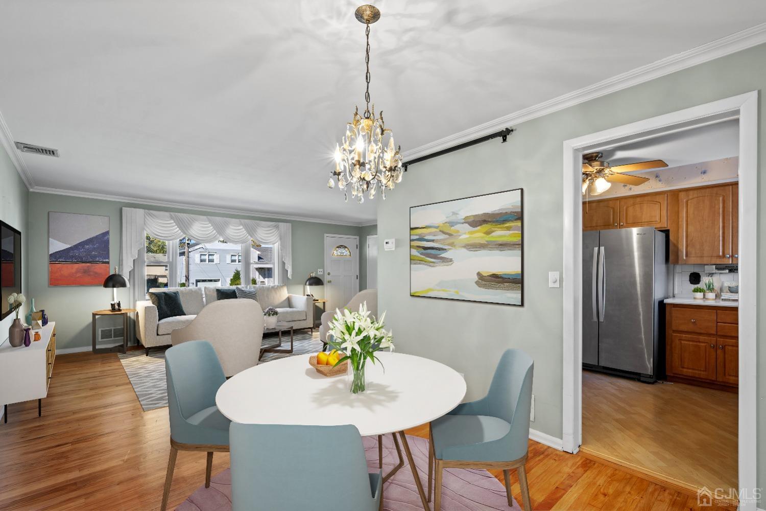 7 Garside Place Clark, NJ 07066 - Photo 13 of 34 a view of a dining room with furniture wooden floor and chandelier