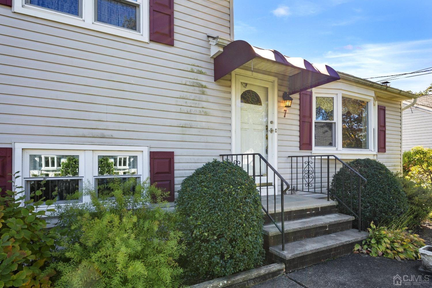 7 Garside Place Clark, NJ 07066 - Photo 2 of 34 a front view of a house with a yard