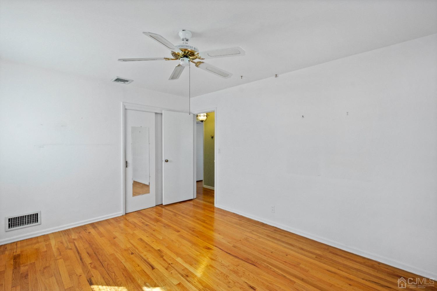 7 Garside Place Clark, NJ 07066 - Photo 21 of 34 a view of empty room with wooden floor