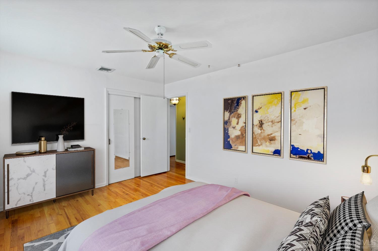 7 Garside Place Clark, NJ 07066 - Photo 22 of 34 a bedroom with a bed and a flat screen tv