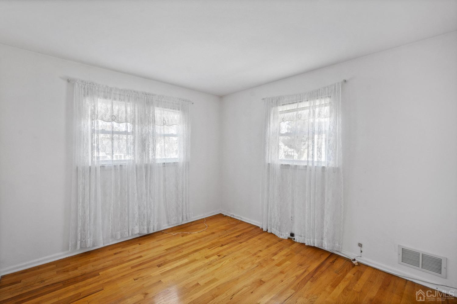 7 Garside Place Clark, NJ 07066 - Photo 25 of 34 a view of empty room with wooden floor