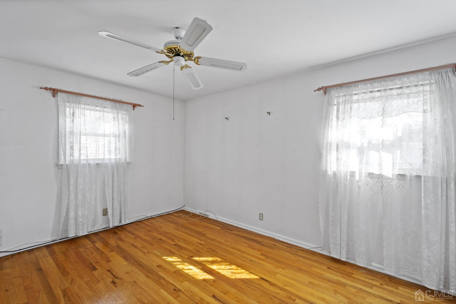 7 Garside Place Clark, NJ 07066 - Photo 27 of 34 wooden floor in an empty room with a window