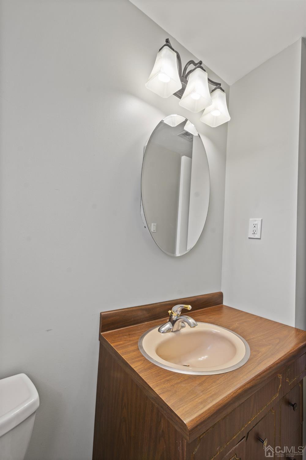 7 Garside Place Clark, NJ 07066 - Photo 28 of 34 a bathroom with a sink and a mirror