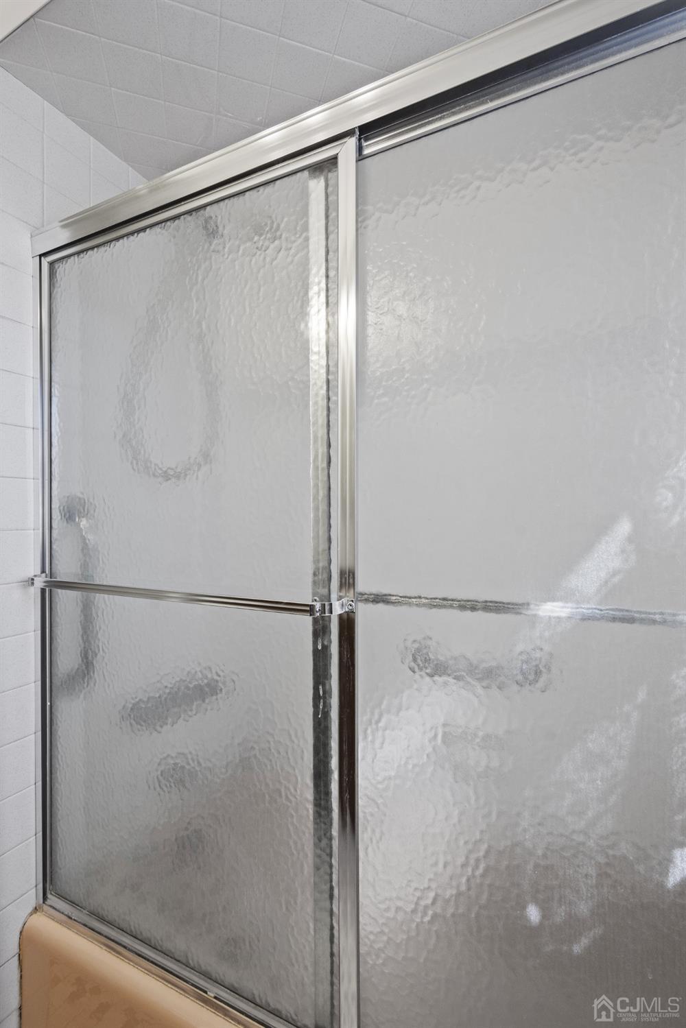 7 Garside Place Clark, NJ 07066 - Photo 29 of 34 a bathroom with a glass shower