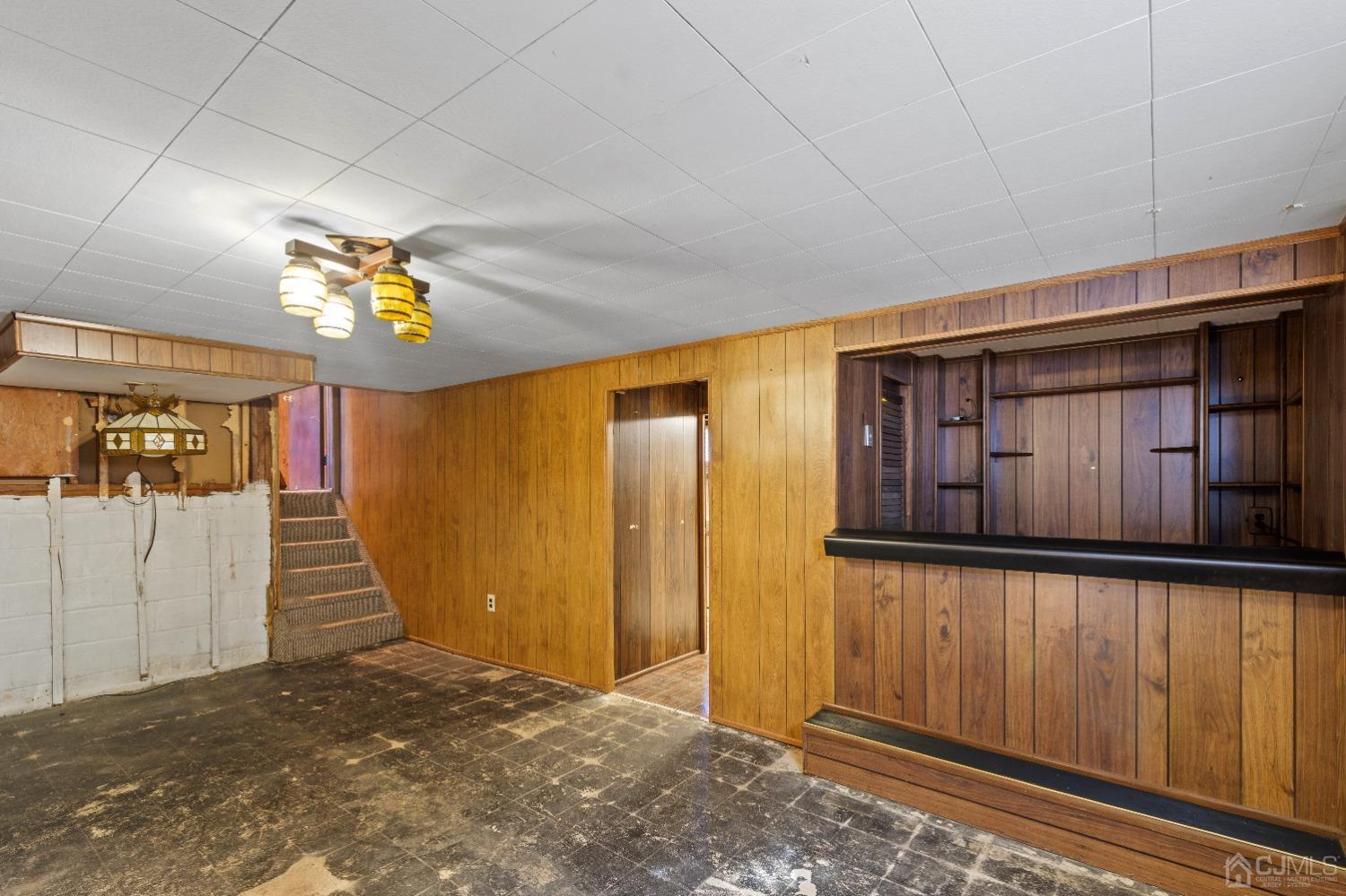 7 Garside Place Clark, NJ 07066 - Photo 32 of 34 a view of a hallway with wooden walls and stairs