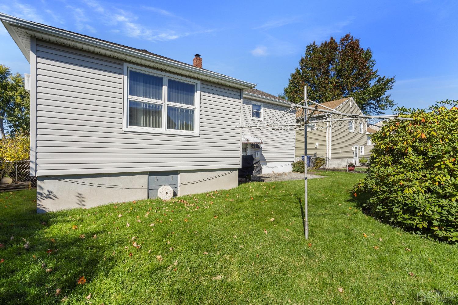 7 Garside Place Clark, NJ 07066 - Photo 4 of 34 a front view of a house with plants and garden