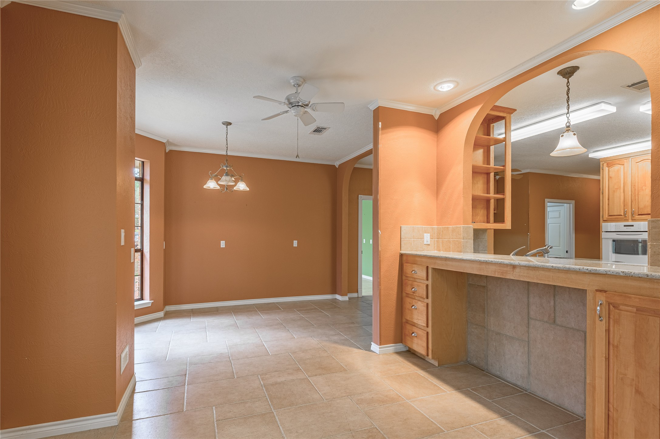 20 Tall Timbers Way Huntsville, TX 77320 - Photo 11 of 41 a view of a hallway with a sink and a refrigerator