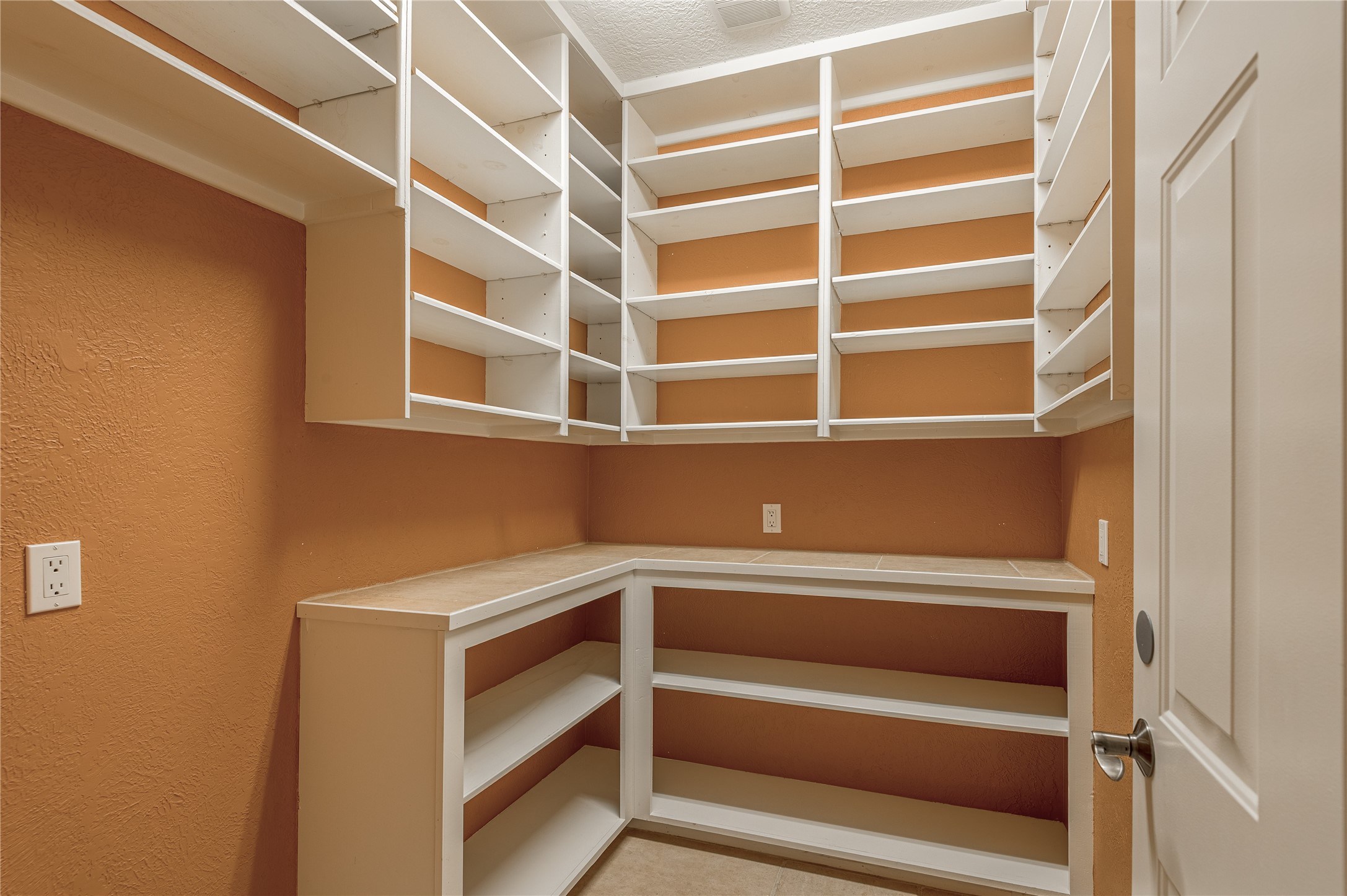 20 Tall Timbers Way Huntsville, TX 77320 - Photo 14 of 41 a view of walk in closet with empty racks