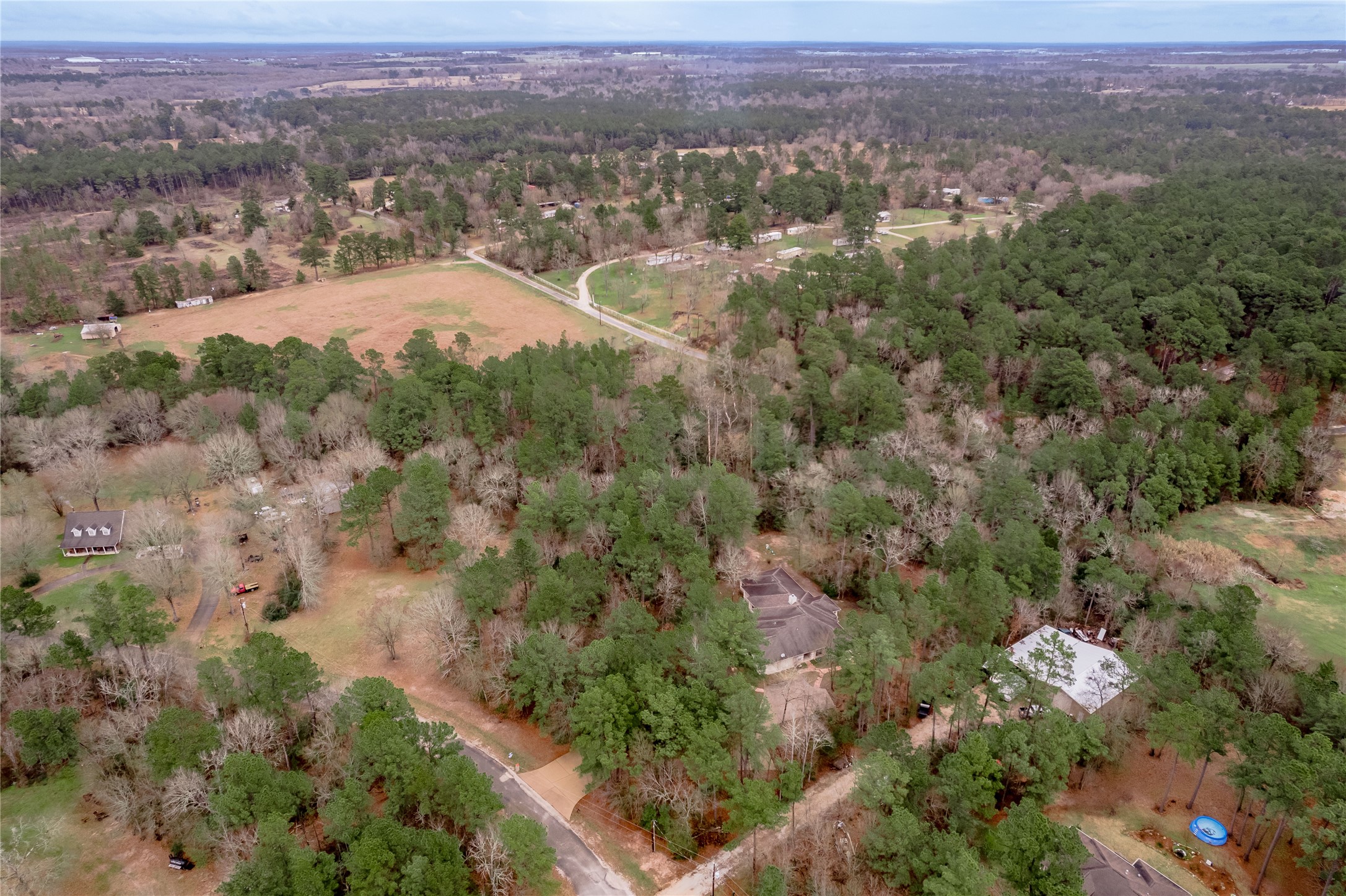 20 Tall Timbers Way Huntsville, TX 77320 - Photo 34 of 41 an aerial view of residential houses with outdoor space and trees
