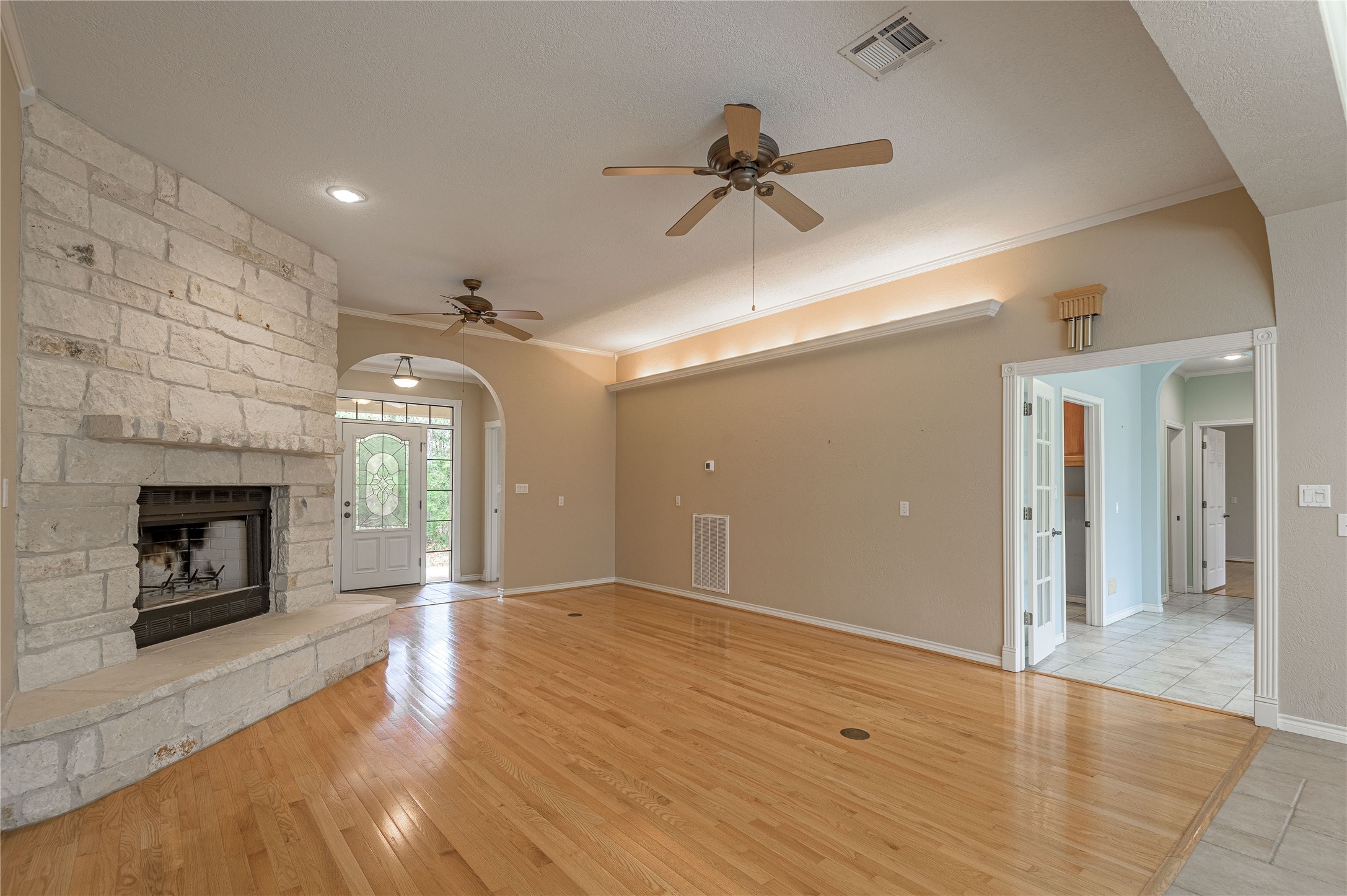 20 Tall Timbers Way Huntsville, TX 77320 - Photo 10 of 41 a view of empty room with wooden floor and fireplace
