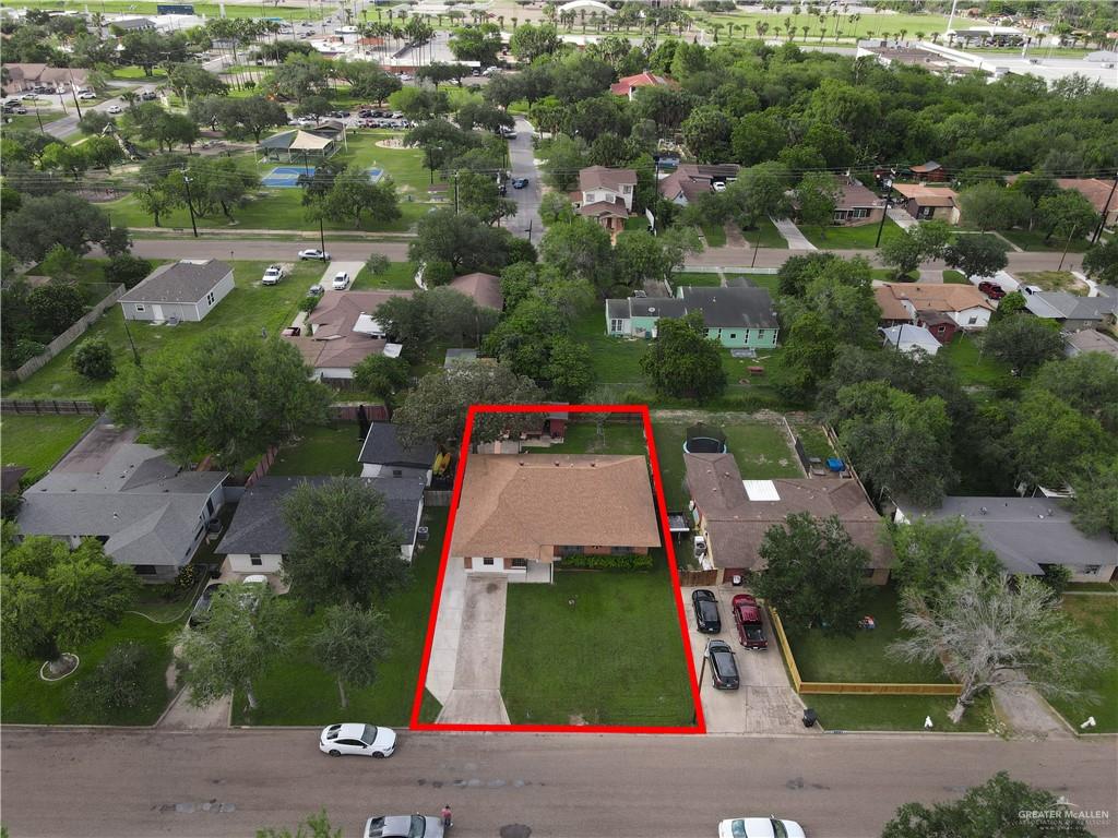 616 5th Street Weslaco, TX 78596 - Photo 8 of 33 an aerial view of residential houses with outdoor space