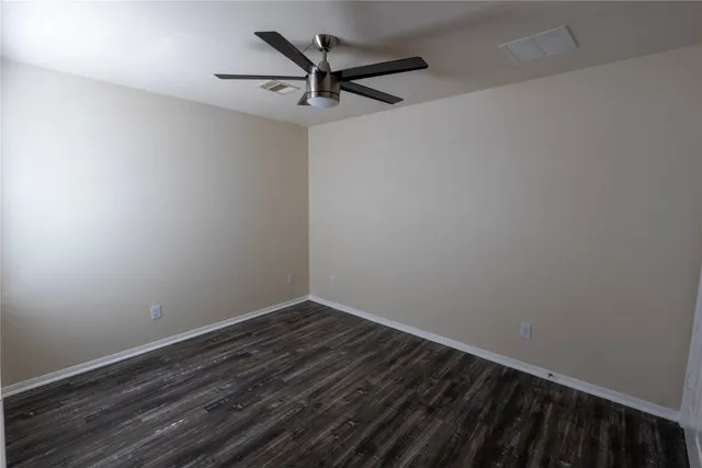 a view of a small space with wooden floor
