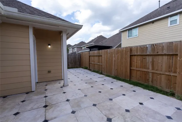 a view of backyard with small cabin