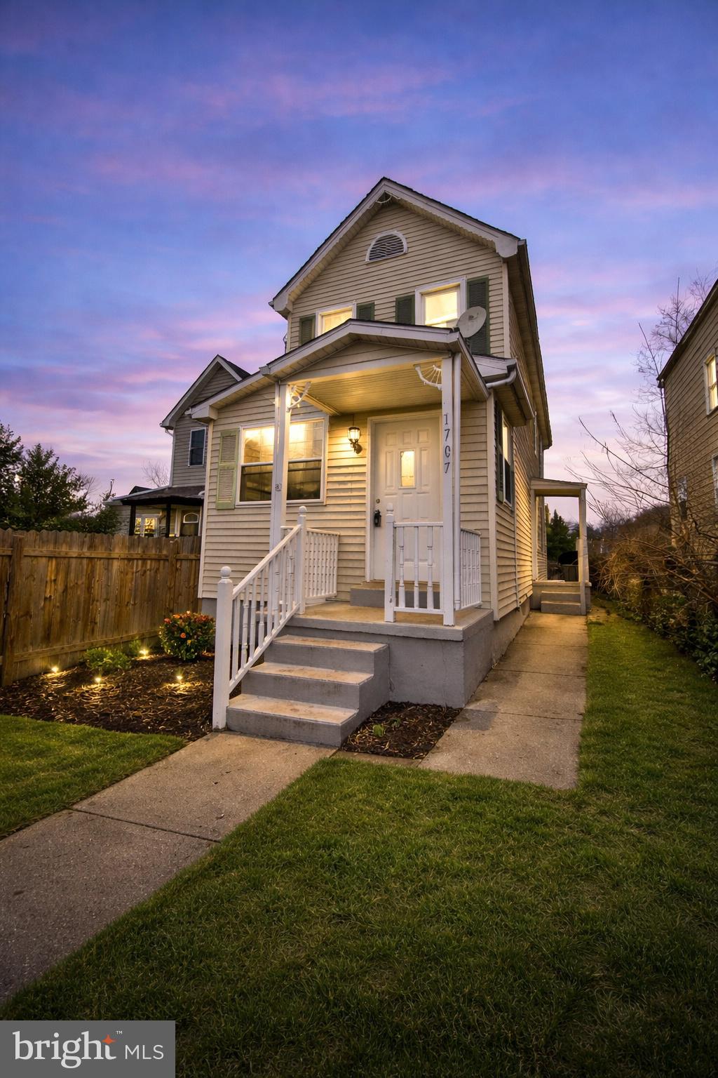 1707 Harman Avenue Baltimore, MD 21230 - Photo 1 of 18 a front view of a house with a yard