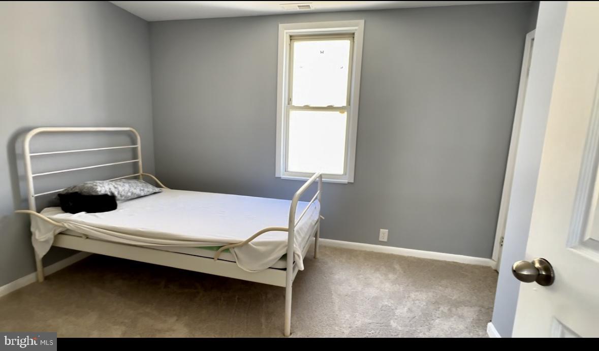 1707 Harman Avenue Baltimore, MD 21230 - Photo 12 of 18 a bedroom with a bed and a window