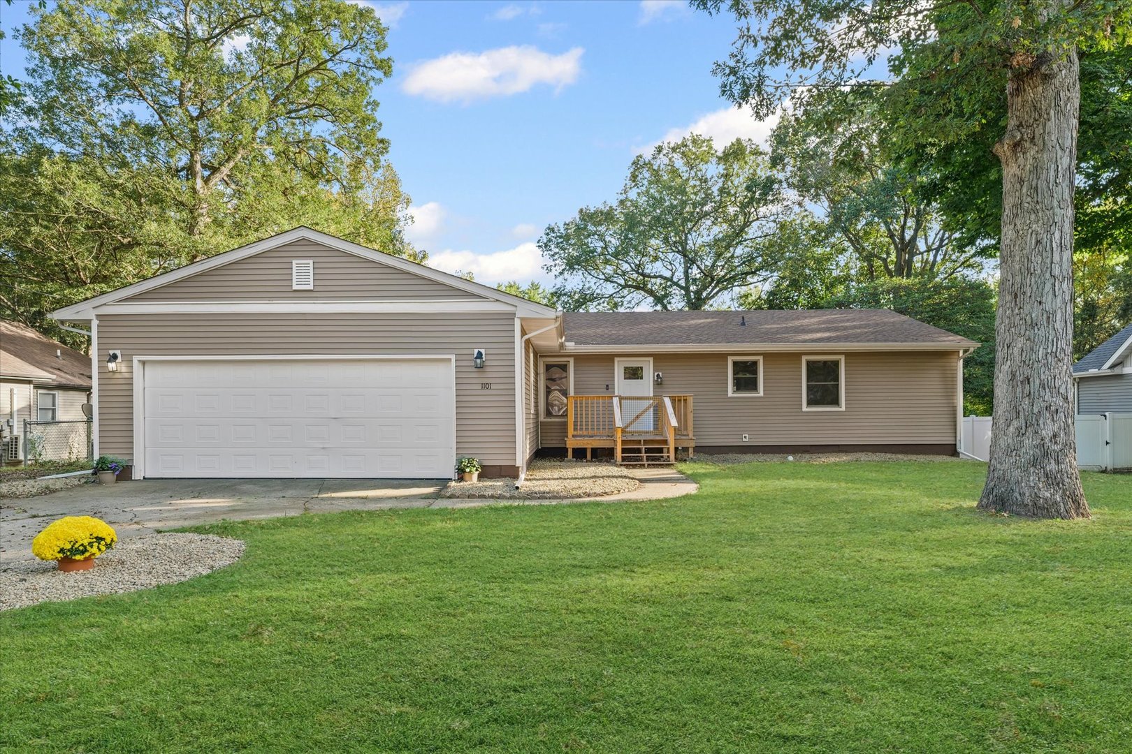 1101 East Pin Oak Drive Mahomet, IL 61853 - Photo 1 of 57 a front view of a house with yard and green space
