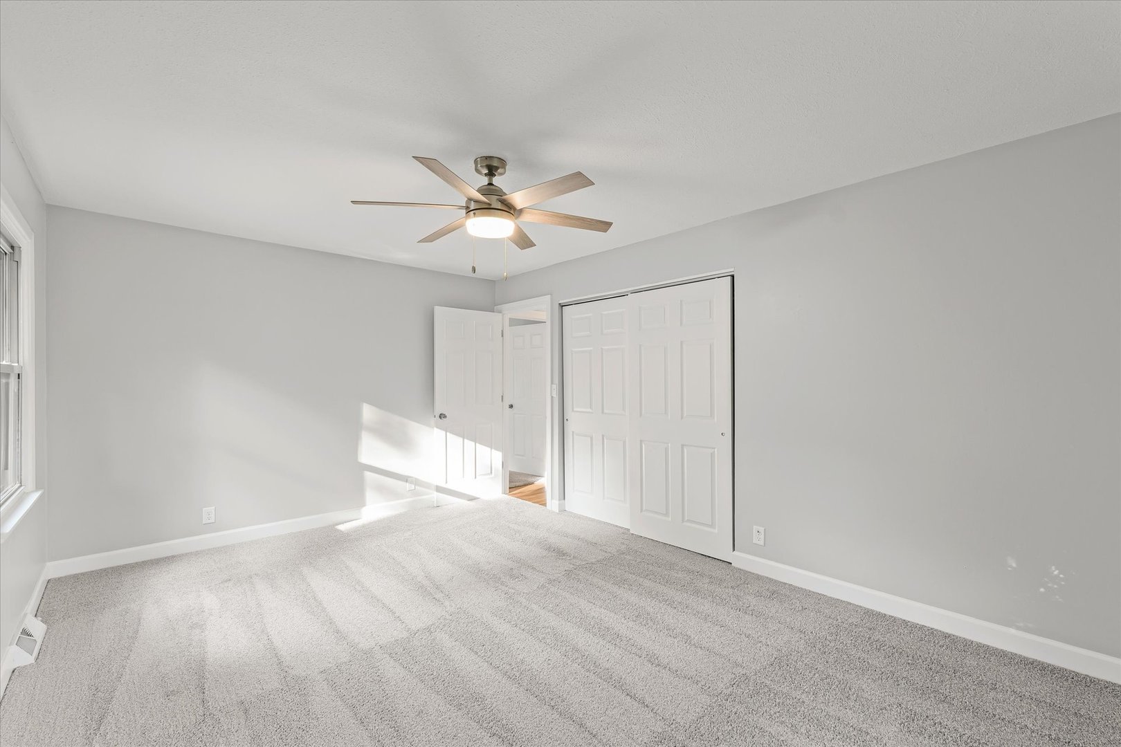 1101 East Pin Oak Drive Mahomet, IL 61853 - Photo 32 of 57 wooden floor in an empty room with a window