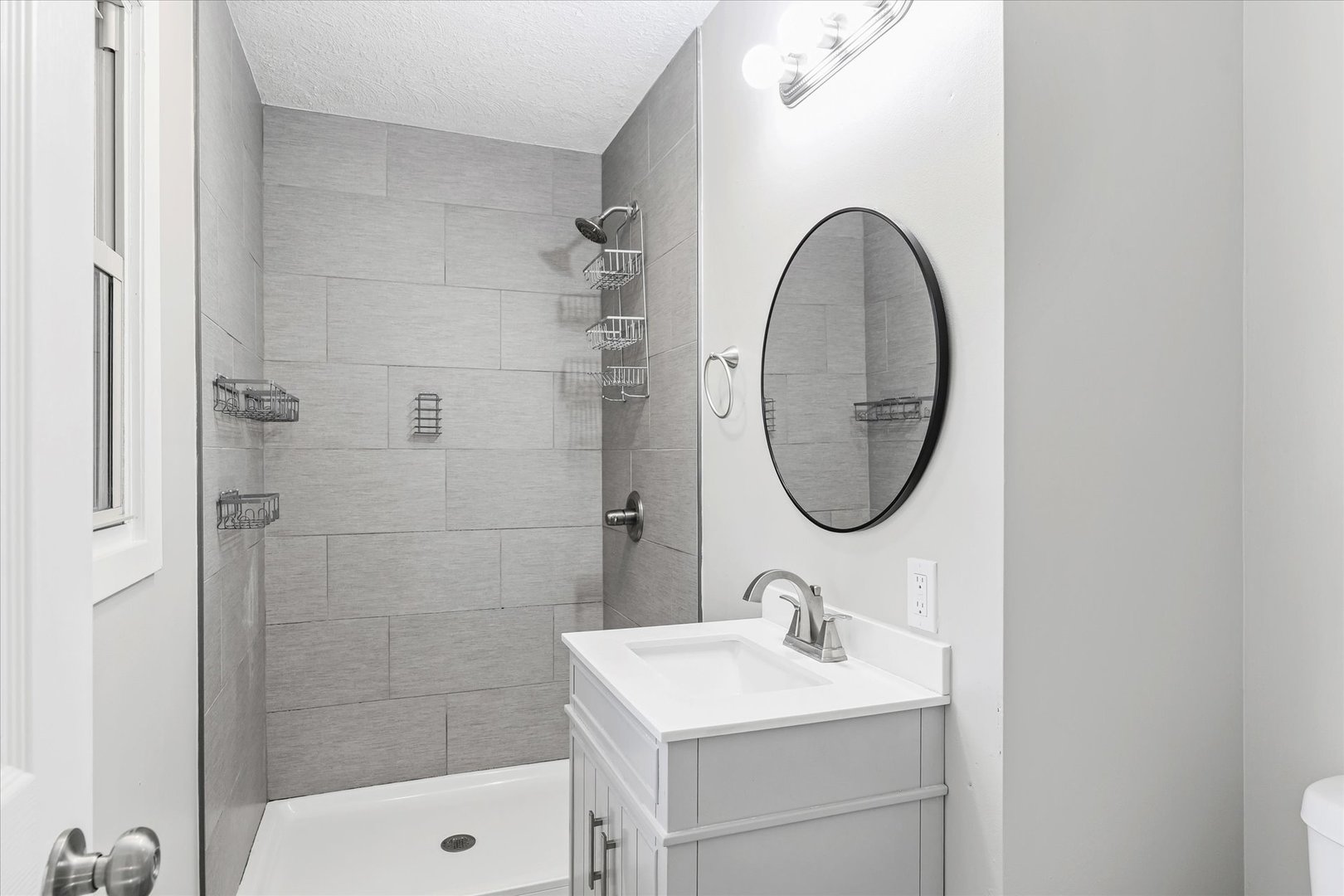 1101 East Pin Oak Drive Mahomet, IL 61853 - Photo 37 of 57 a bathroom with a sink a toilet and a mirror