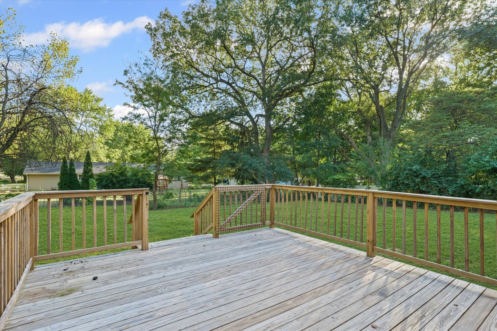 1101 East Pin Oak Drive Mahomet, IL 61853 - Photo 56 of 57 a deck with trees in front of it