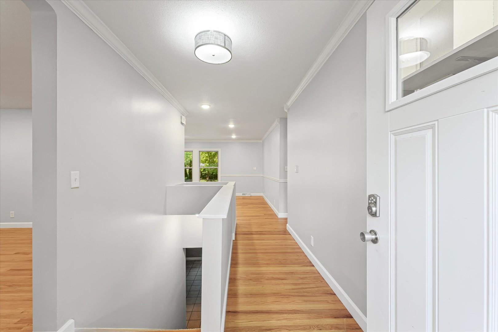1101 East Pin Oak Drive Mahomet, IL 61853 - Photo 9 of 57 a view of a hallway with wooden floor and entryway