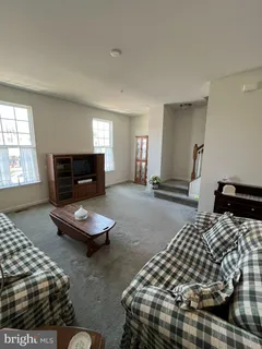 a bedroom with bed and a tv