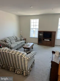 a bedroom with bed and a window