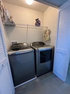 a stove top oven sitting inside of a kitchen