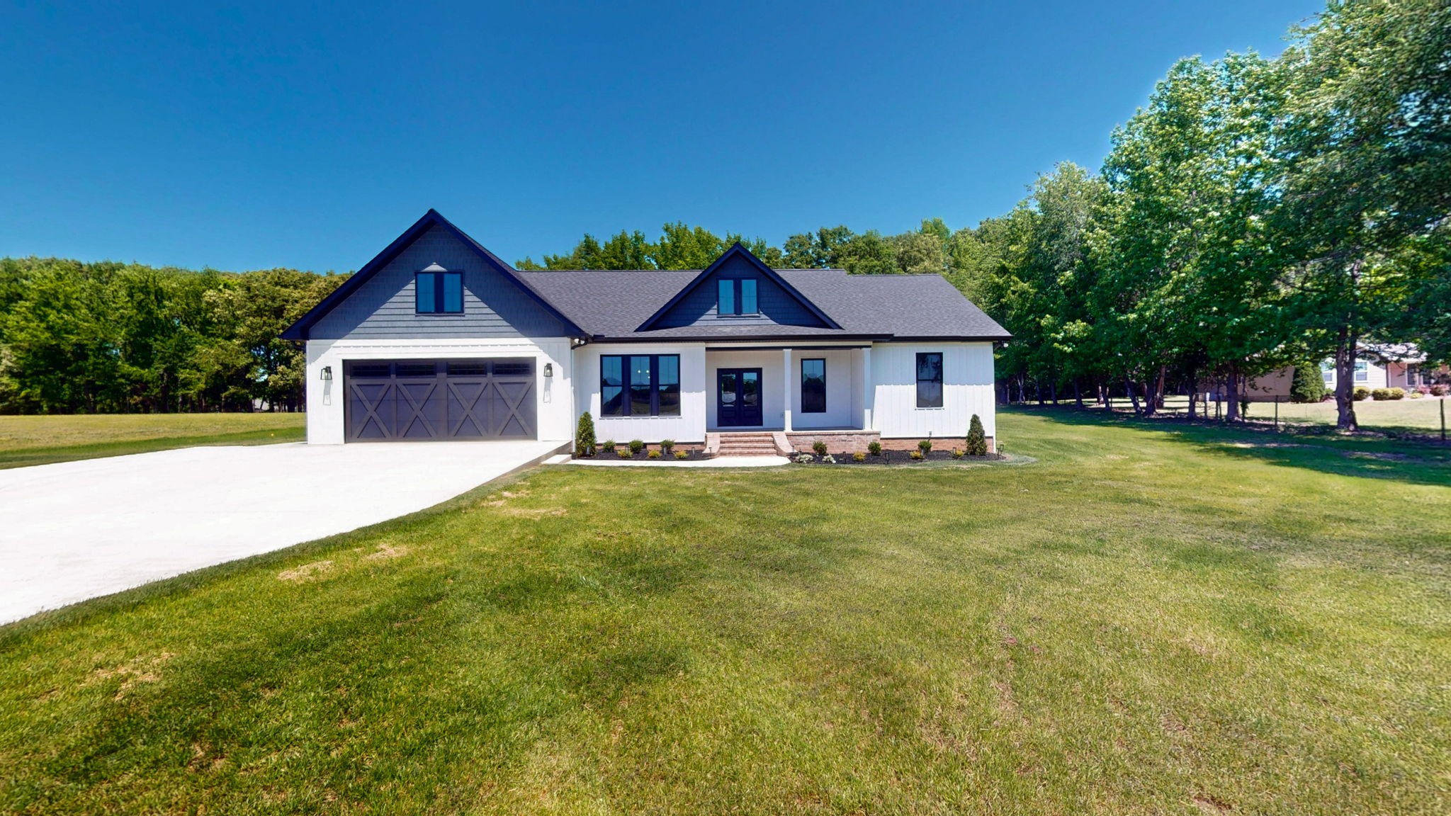 865 Alman Cemetery Road Paris, TN 38242 - Photo 32 of 41 a front view of a house with garden