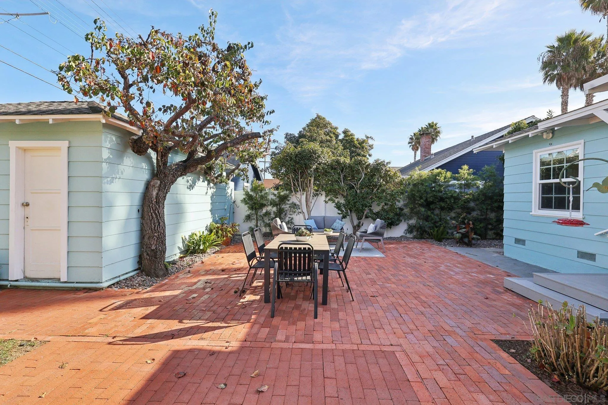 506 South Freeman Street Oceanside, CA 92054 - Photo 12 of 20 a view of a patio with table and chairs and potted plants