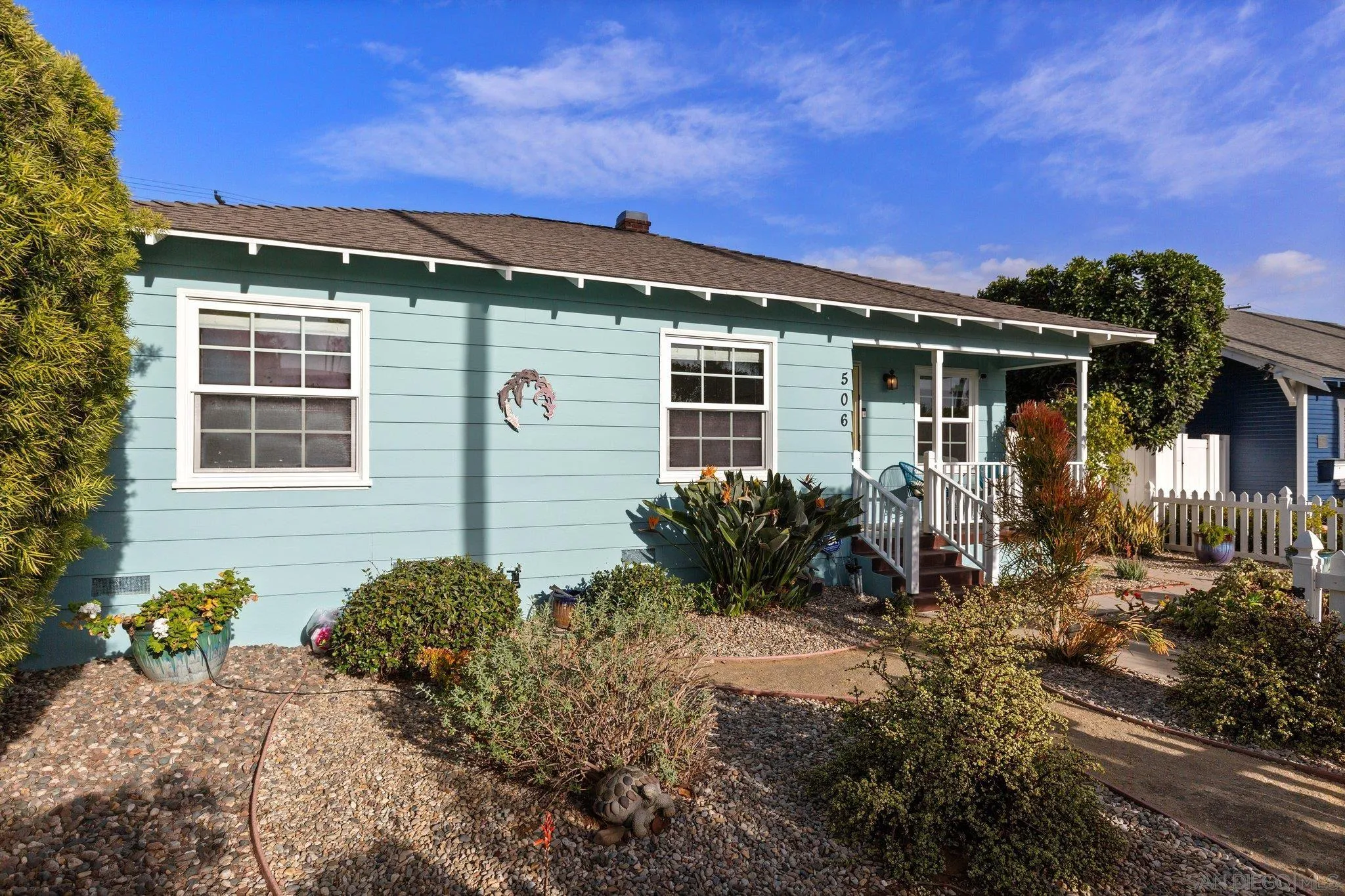 506 South Freeman Street Oceanside, CA 92054 - Photo 2 of 20 a front view of a house with a yard