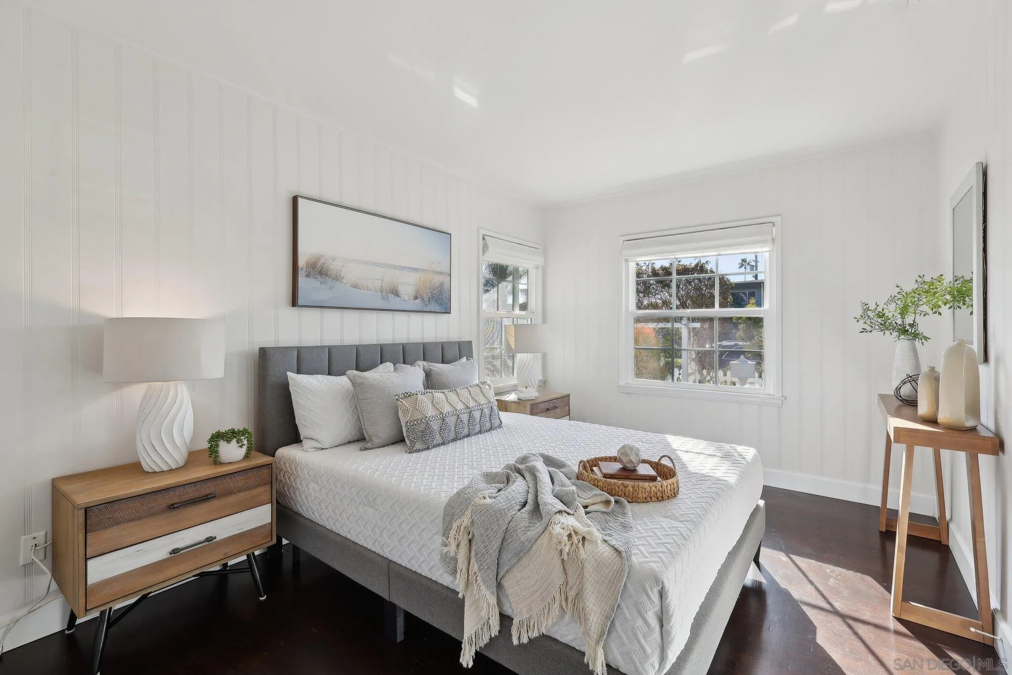 506 South Freeman Street Oceanside, CA 92054 - Photo 7 of 20 a bedroom with a bed and wooden floor