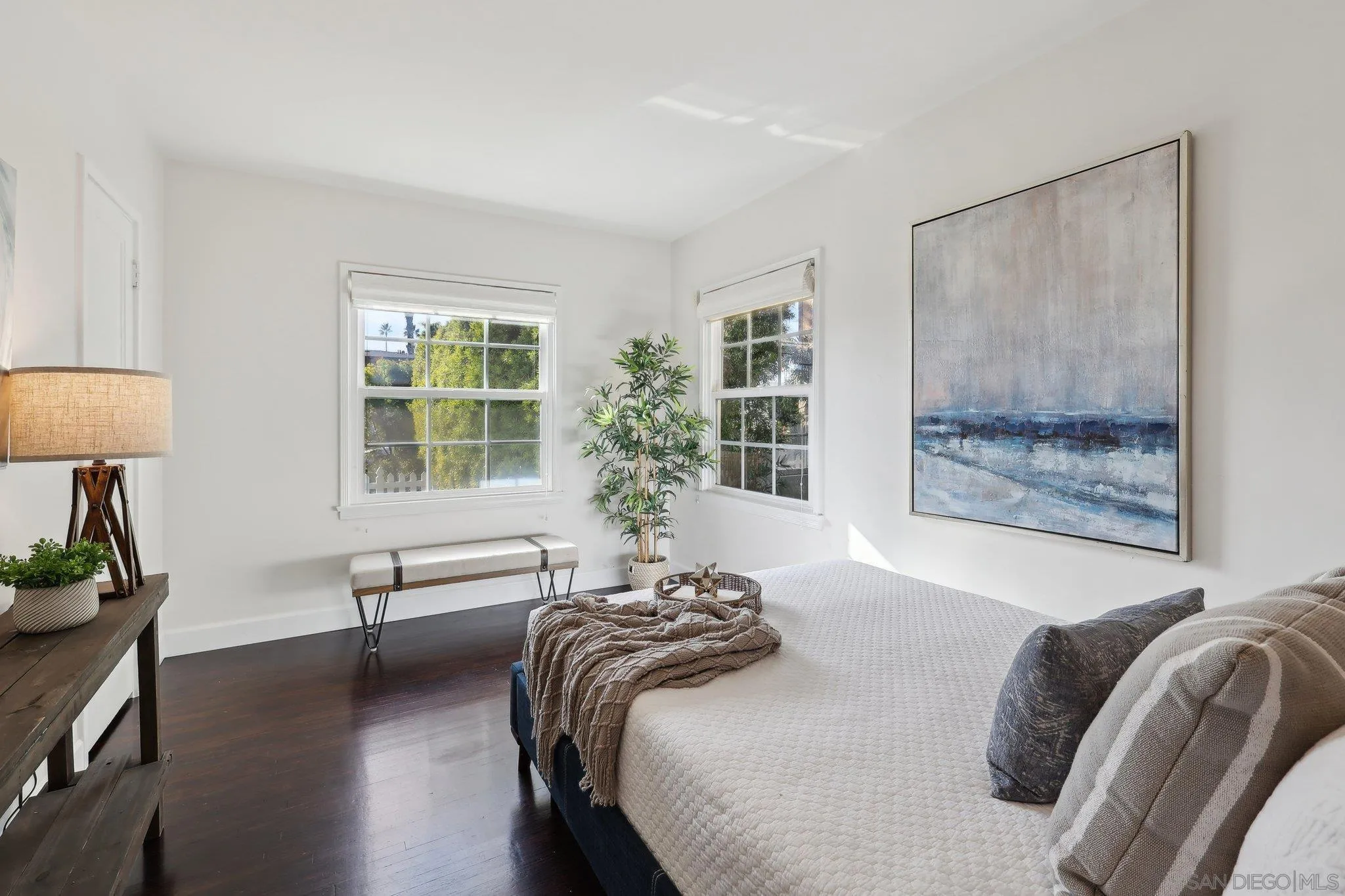 506 South Freeman Street Oceanside, CA 92054 - Photo 8 of 20 a bedroom with a bed and a lamp on table