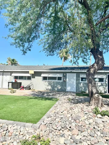 front view of a house with a yard