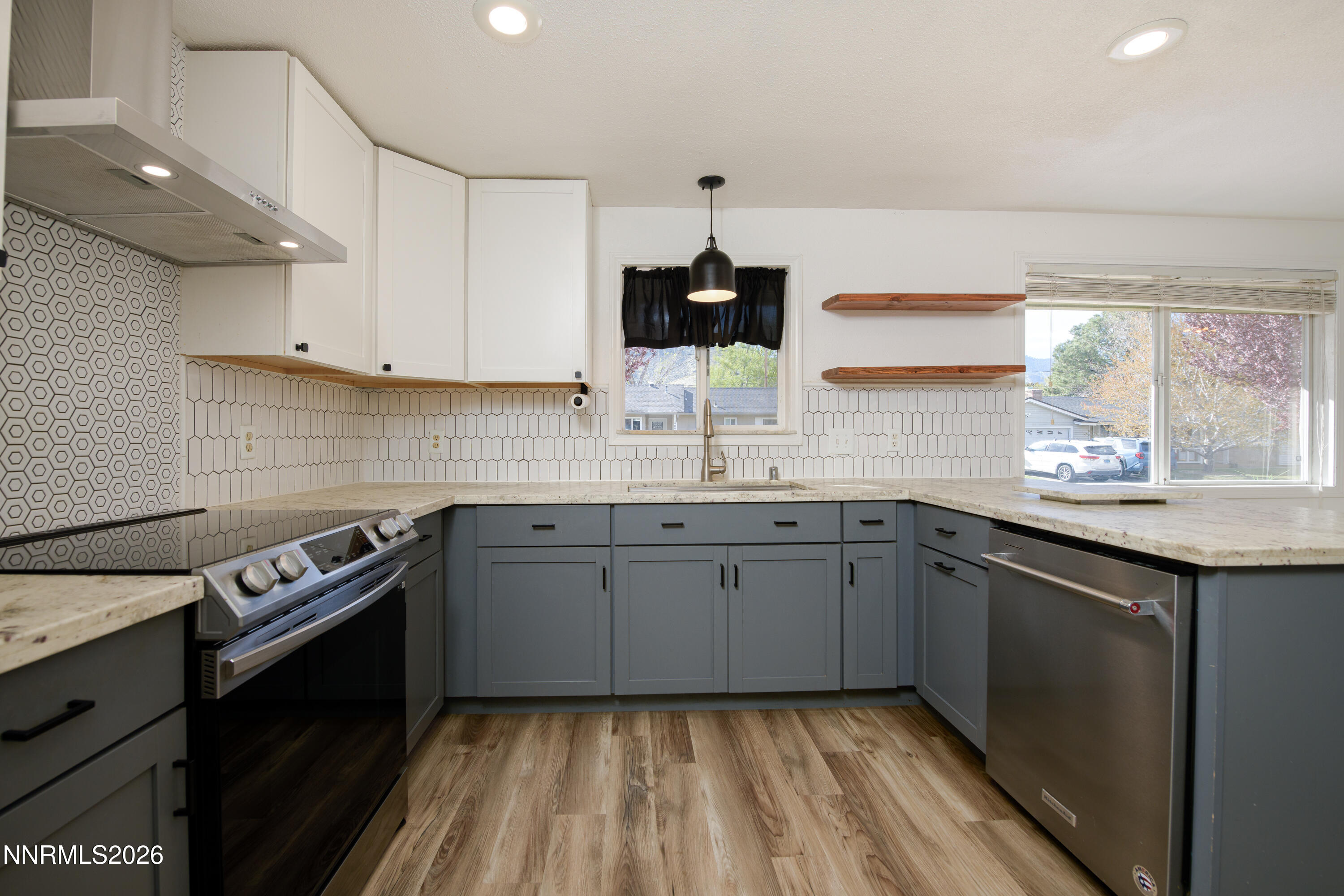 901 Sharrow Way Carson City, NV 89703 - Photo 11 of 45 a kitchen with a sink stove and cabinets