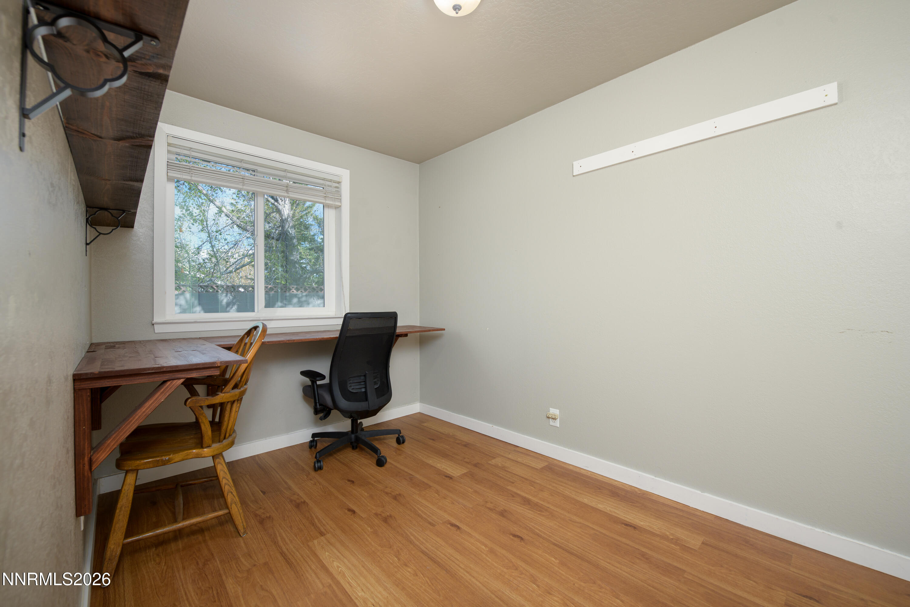 901 Sharrow Way Carson City, NV 89703 - Photo 19 of 45 a view of a workspace with furniture and a window