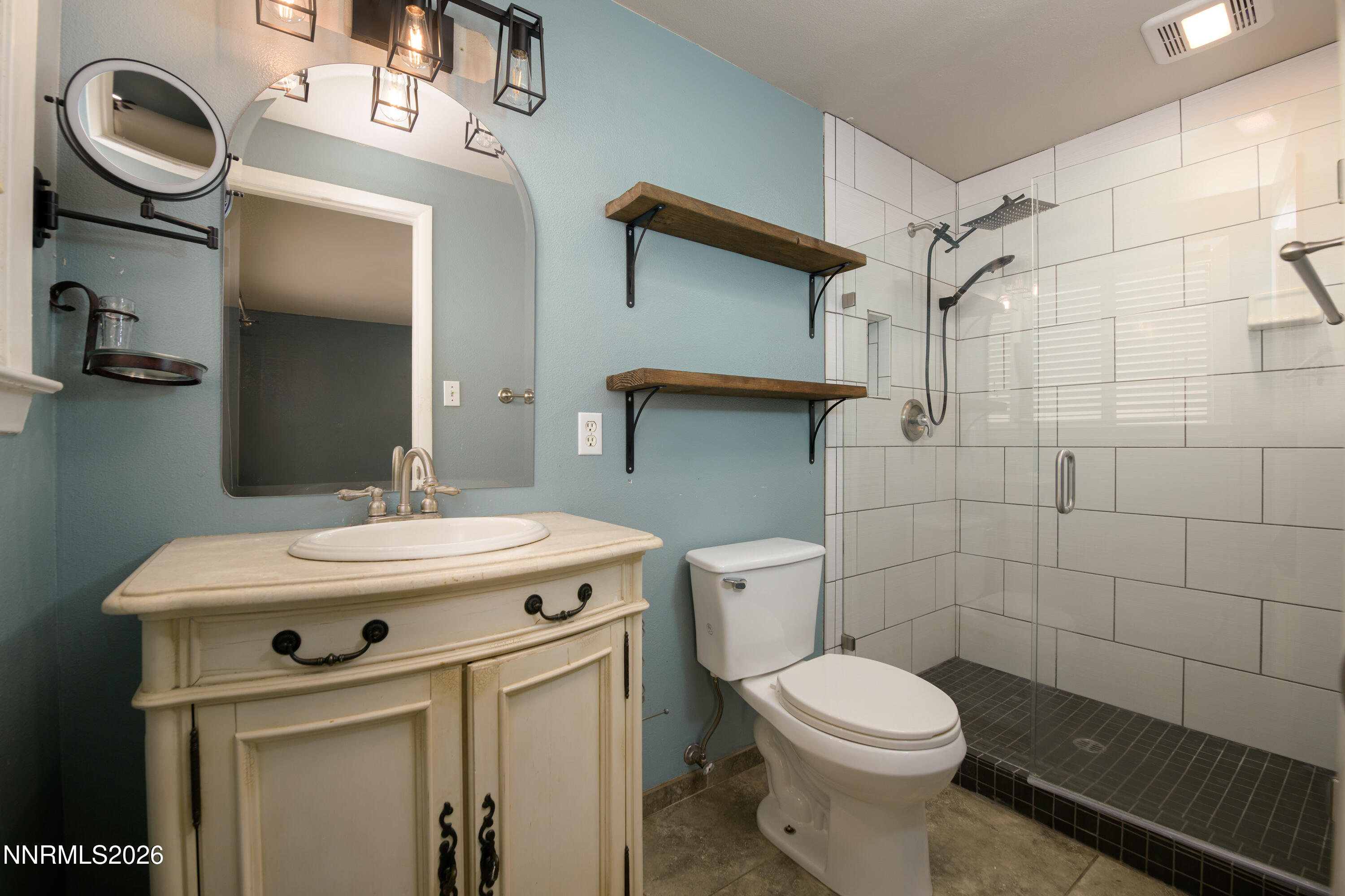 901 Sharrow Way Carson City, NV 89703 - Photo 24 of 45 a bathroom with a sink a toilet and a mirror