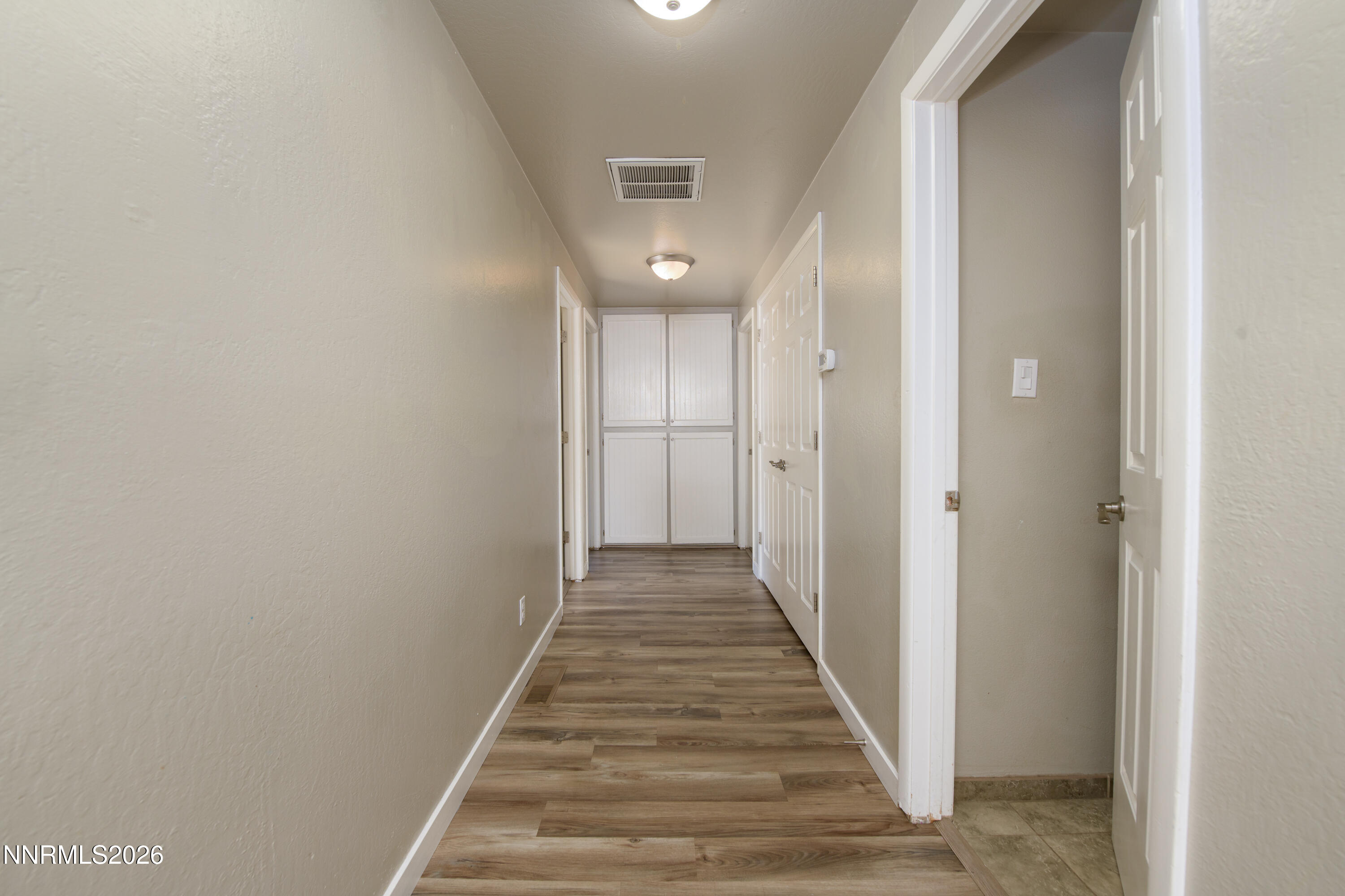 901 Sharrow Way Carson City, NV 89703 - Photo 30 of 45 a view of a hallway with wooden floor and staircase