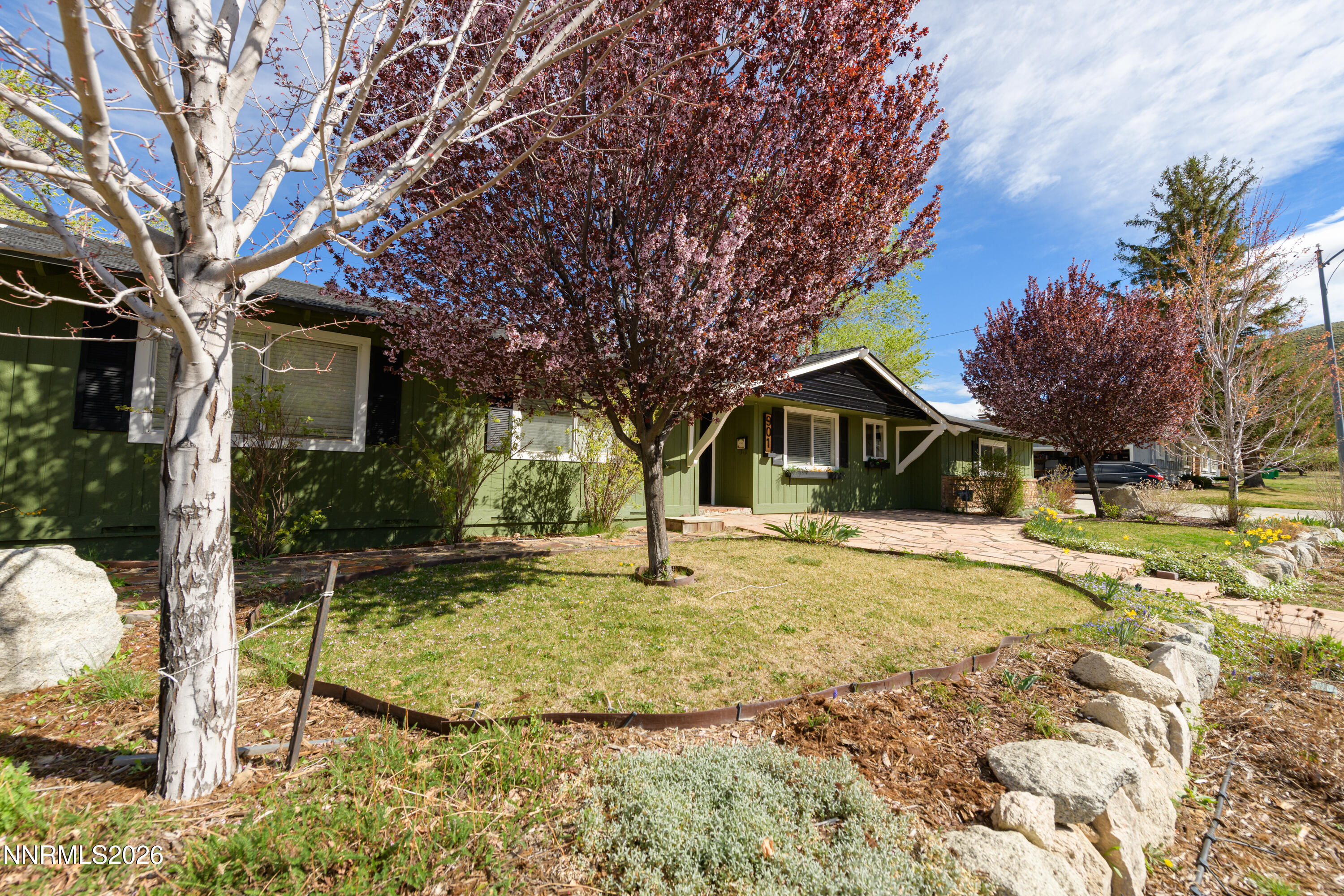 901 Sharrow Way Carson City, NV 89703 - Photo 3 of 45 a house with trees in front of it