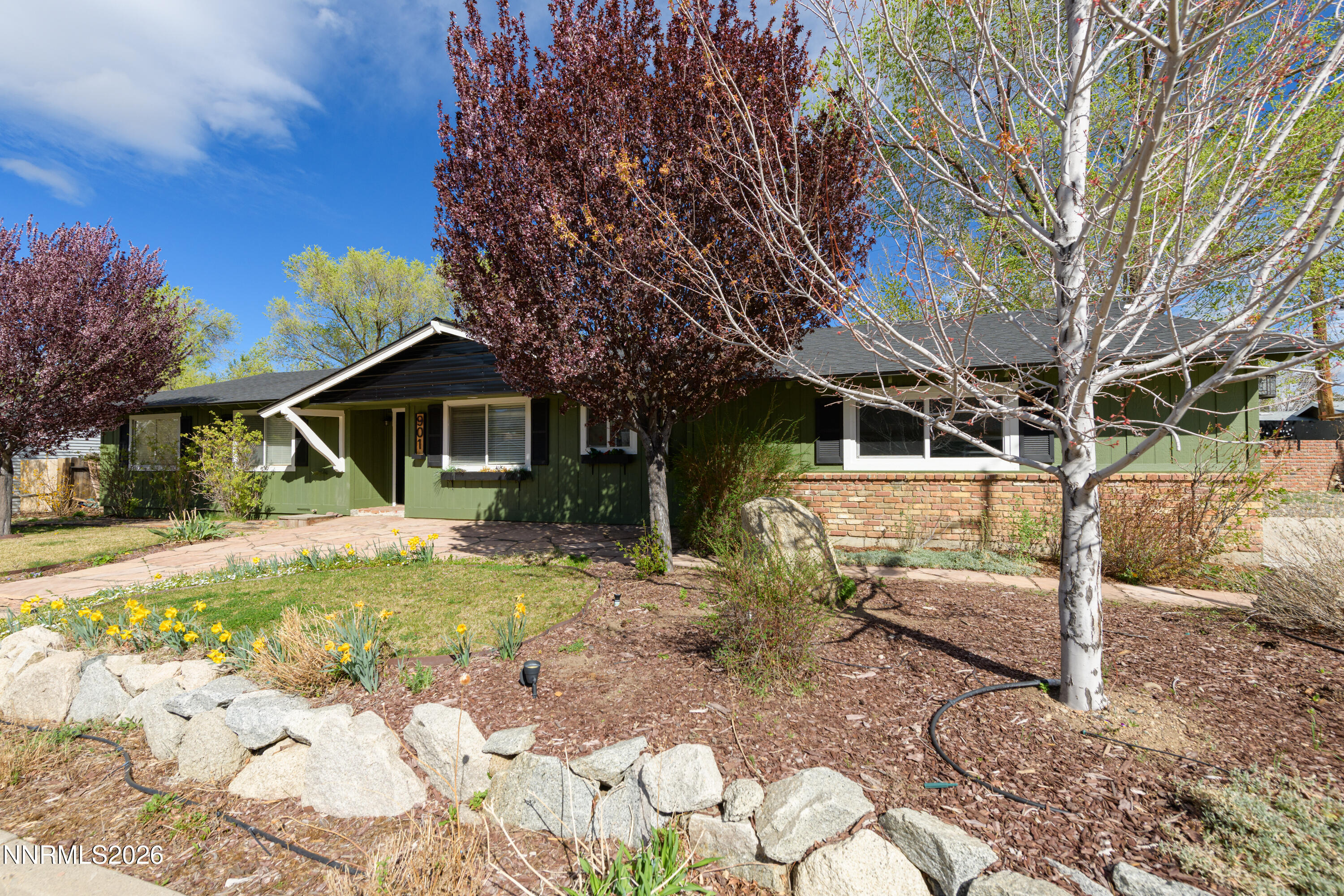 901 Sharrow Way Carson City, NV 89703 - Photo 4 of 45 a front view of a house with a yard