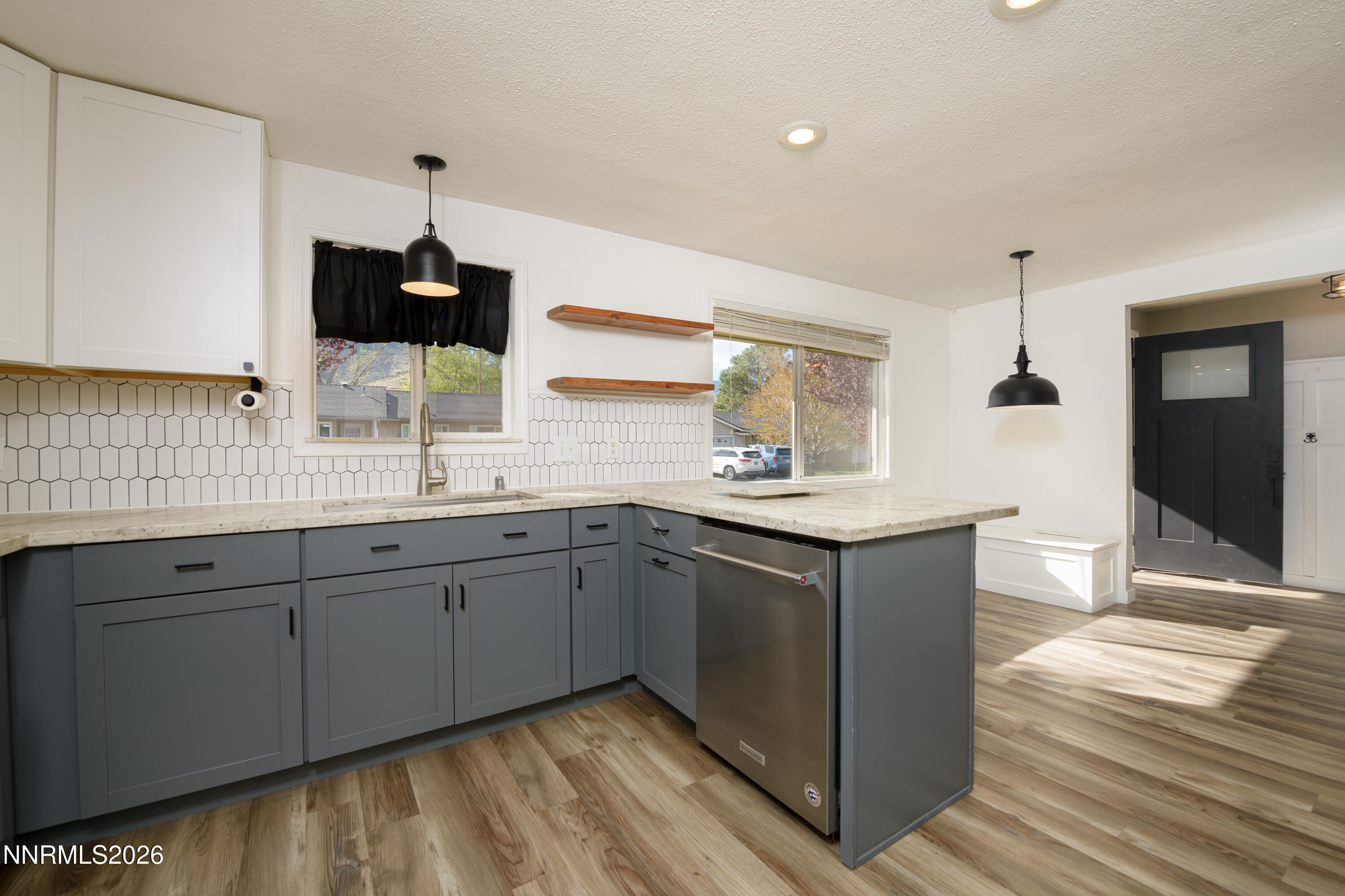 901 Sharrow Way Carson City, NV 89703 - Photo 10 of 45 a kitchen with stainless steel appliances granite countertop a sink and stove top oven