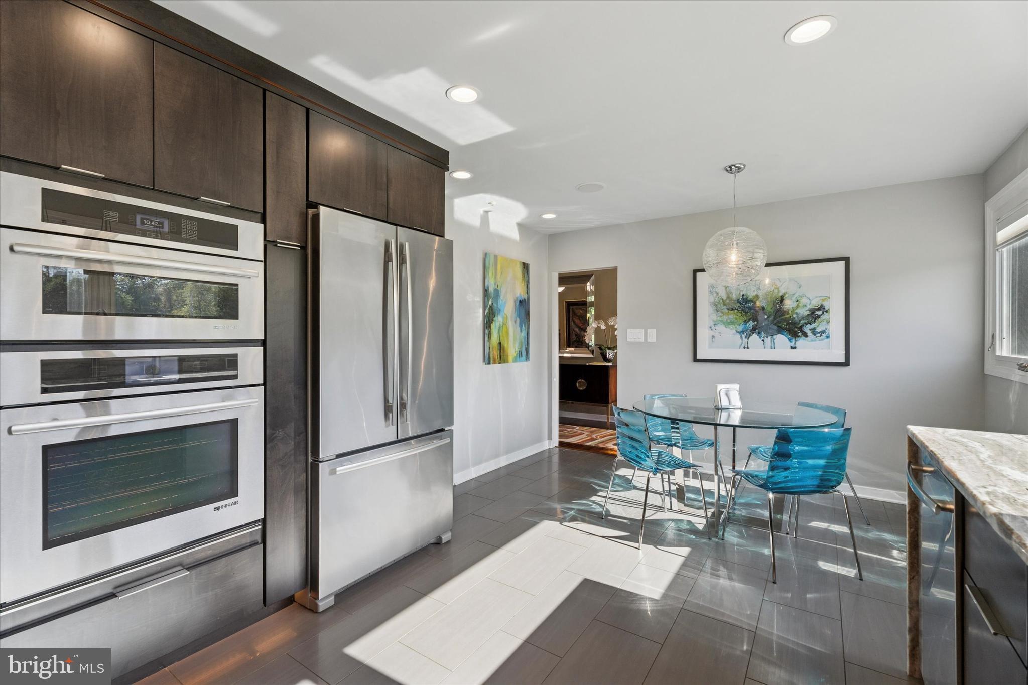 1641 Chattin Road Glenside, PA 19038 - Photo 11 of 48 a kitchen with stainless steel appliances a refrigerator and a stove top oven