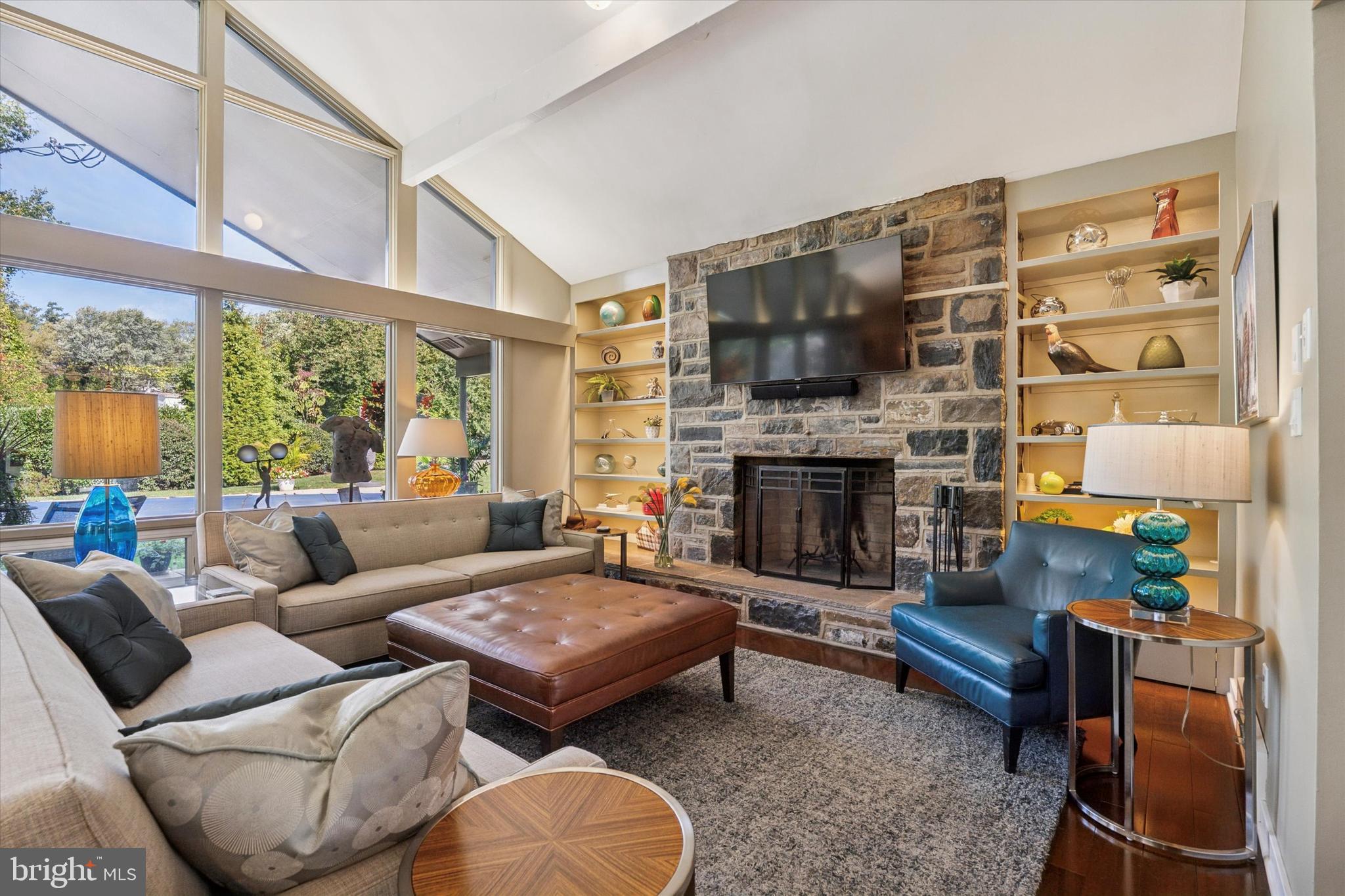 1641 Chattin Road Glenside, PA 19038 - Photo 15 of 48 a living room with furniture fireplace and a large window
