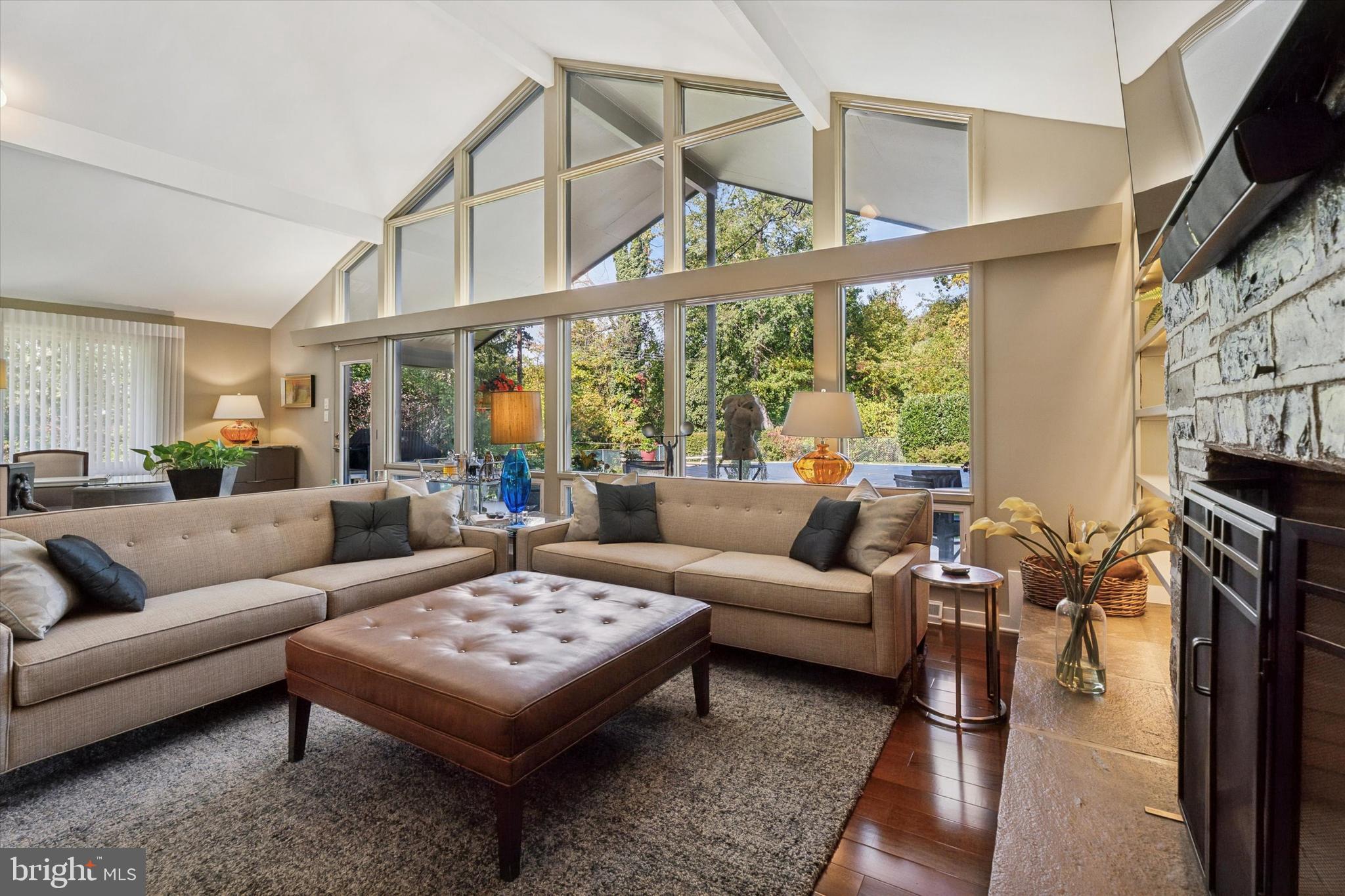 1641 Chattin Road Glenside, PA 19038 - Photo 16 of 48 a living room with furniture a rug and a large window