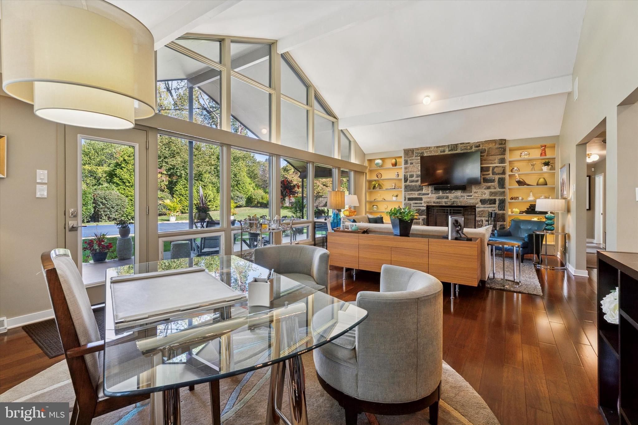 1641 Chattin Road Glenside, PA 19038 - Photo 19 of 48 a dining room with furniture a fireplace and wooden floor