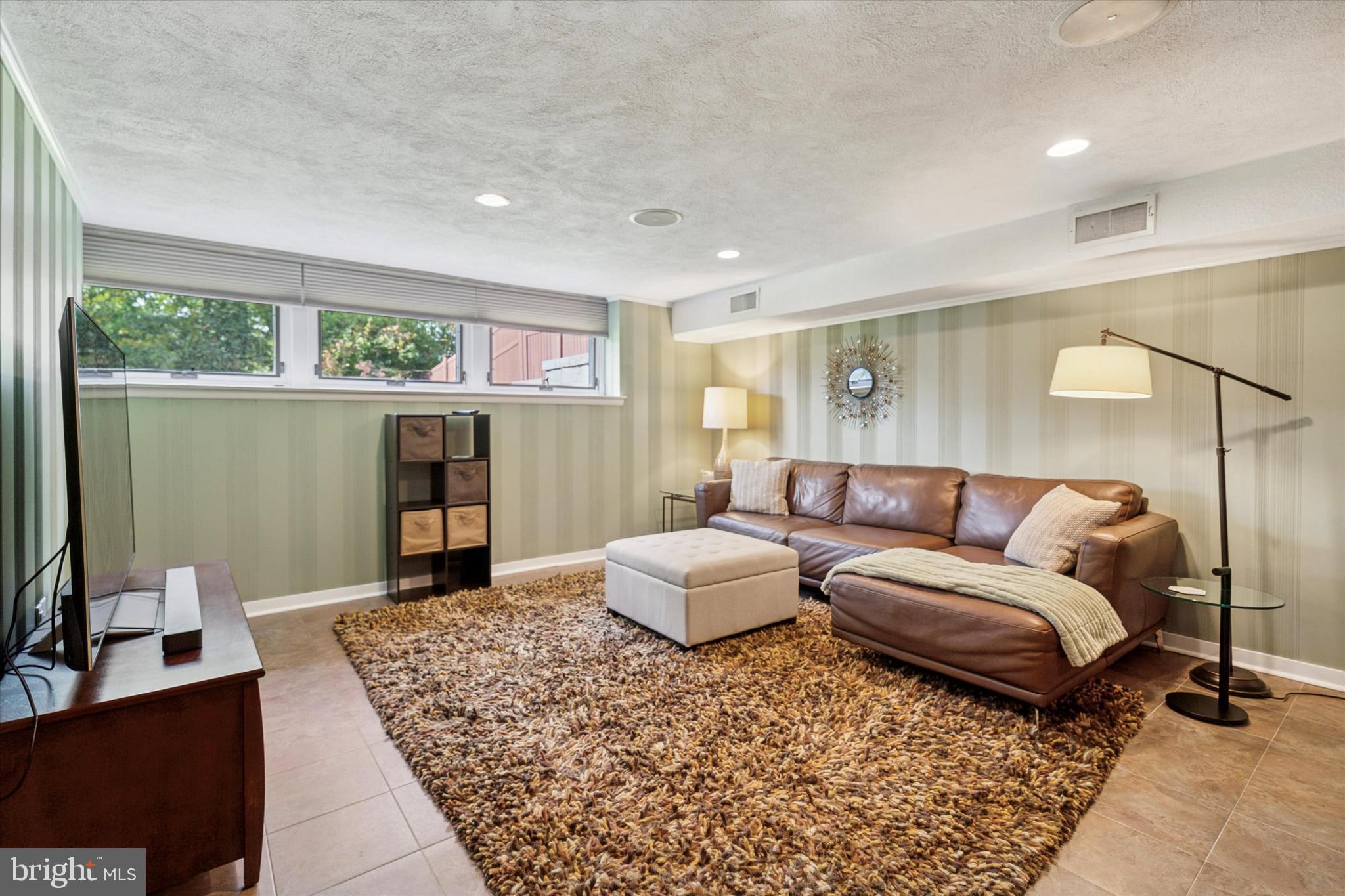 1641 Chattin Road Glenside, PA 19038 - Photo 36 of 48 a living room with furniture and a large window