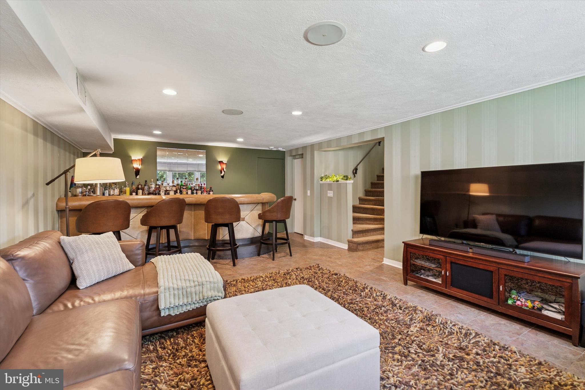 1641 Chattin Road Glenside, PA 19038 - Photo 37 of 48 a living room with furniture and a flat screen tv