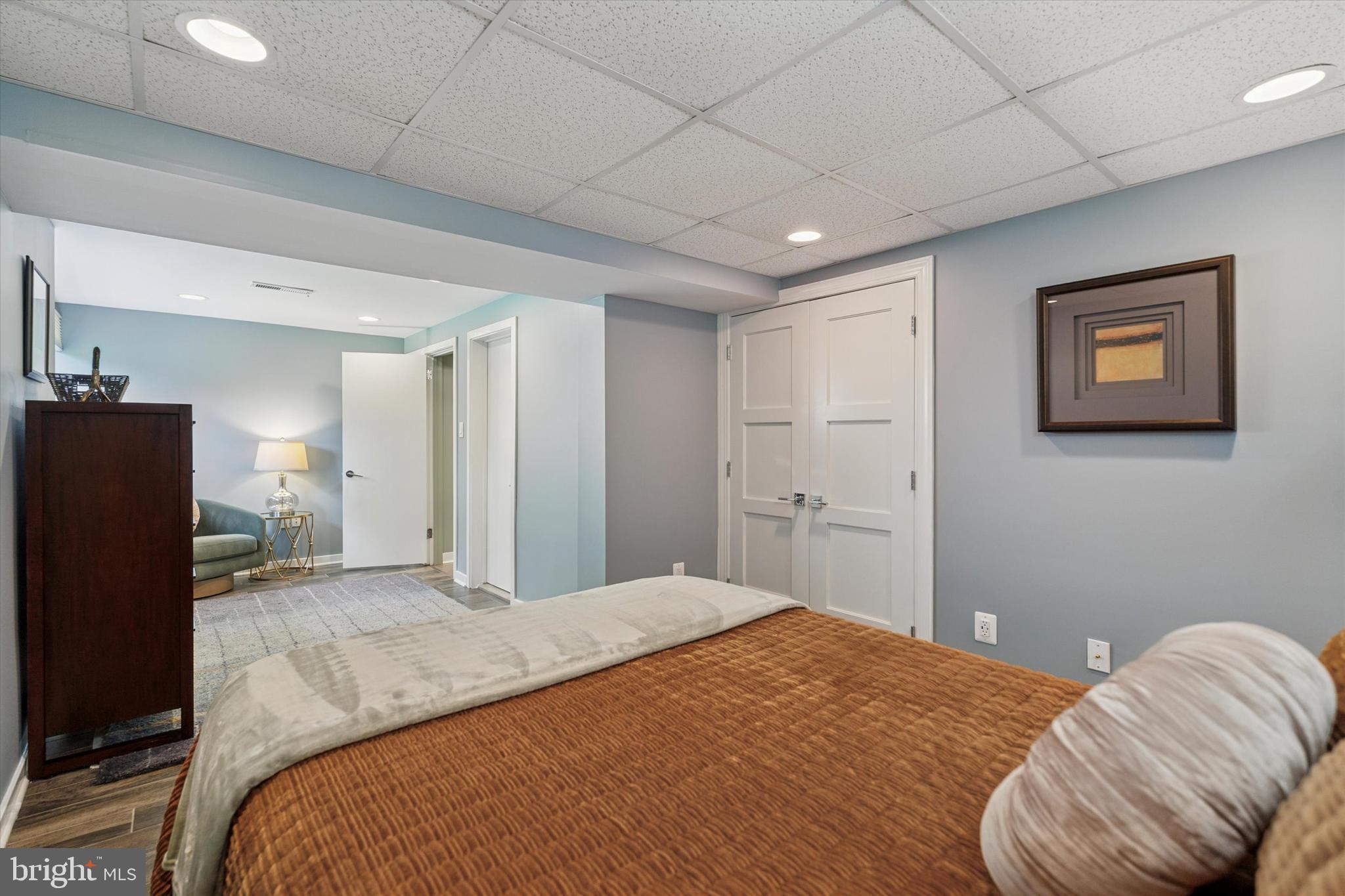 1641 Chattin Road Glenside, PA 19038 - Photo 40 of 48 a bedroom with a bed and a couch