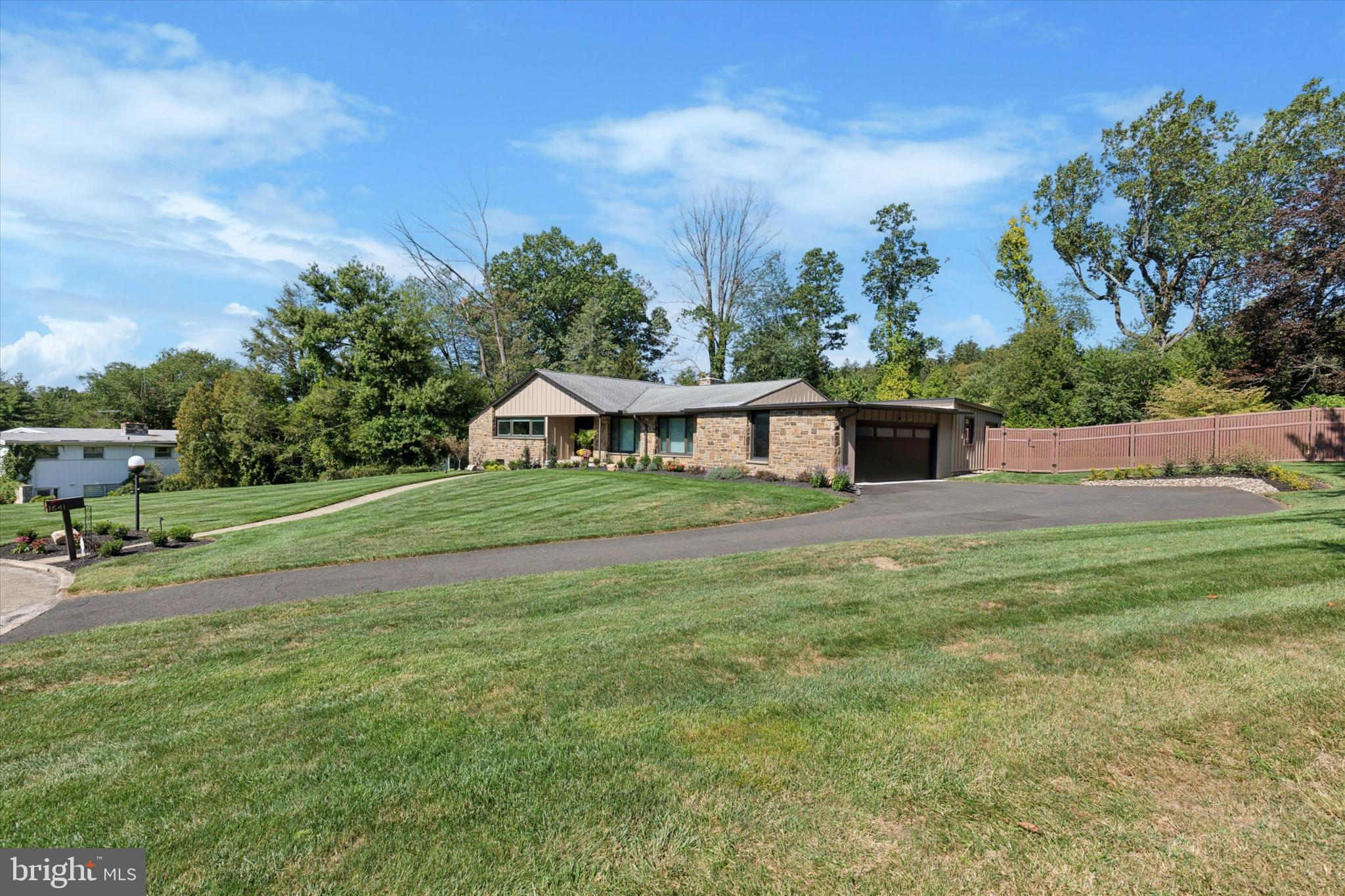 1641 Chattin Road Glenside, PA 19038 - Photo 4 of 48 a front view of a house with garden