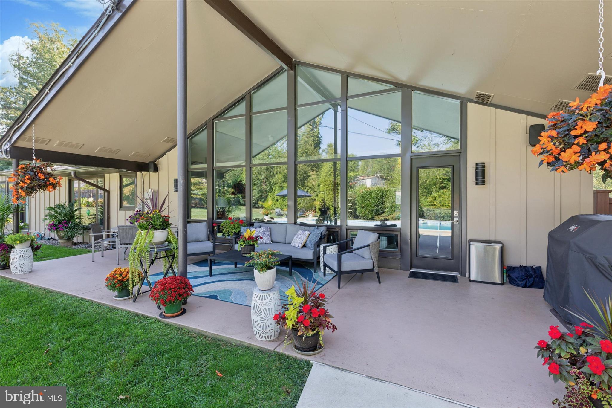 1641 Chattin Road Glenside, PA 19038 - Photo 42 of 48 a living room filled with furniture and a chandelier
